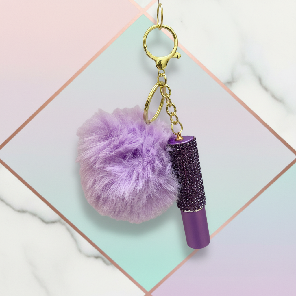Complete purple pom-pom keychain with full key ring visible