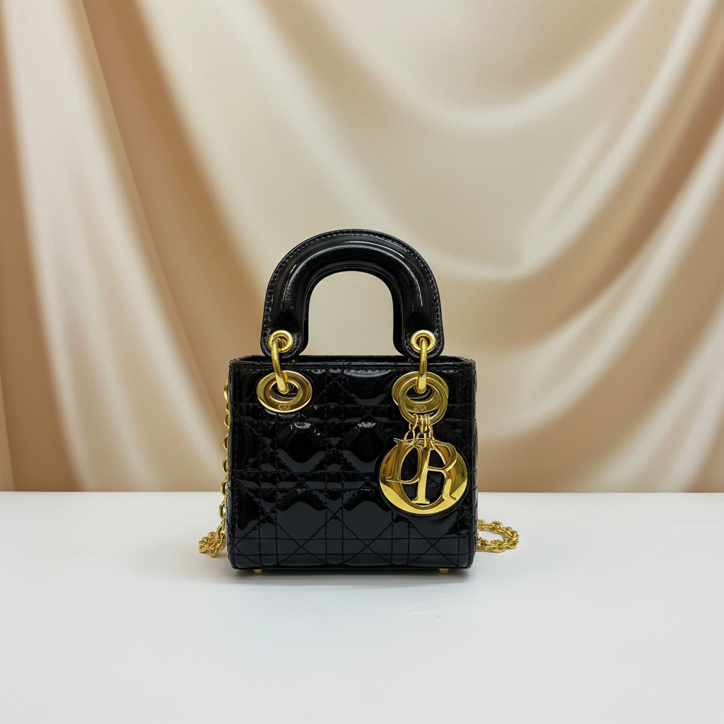Professional elegant background for glossy black quilted mini bag