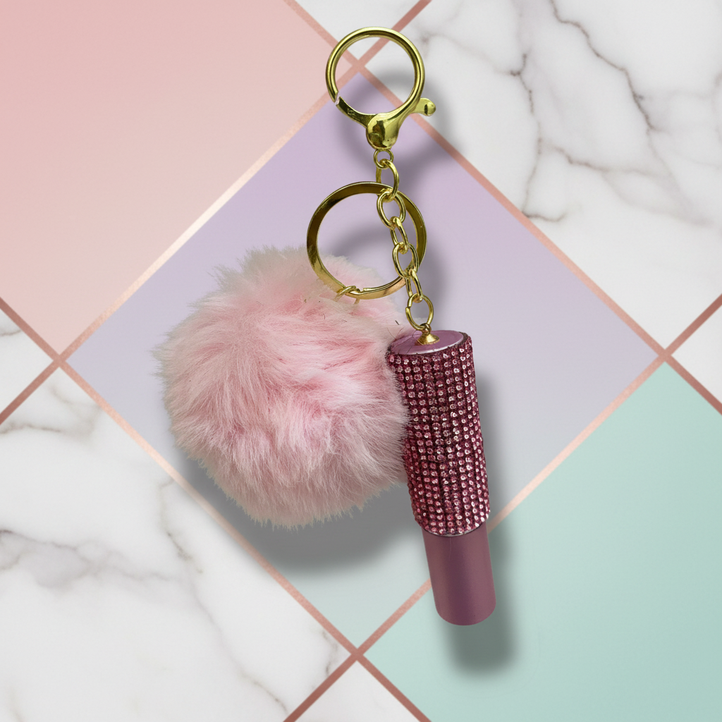 Unique stylish background for pink pom-pom keychain
